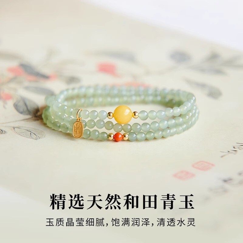 The Hetian jade bracelet features a ethnic style with three layers of natural high-ice green jade and amber in the south red color